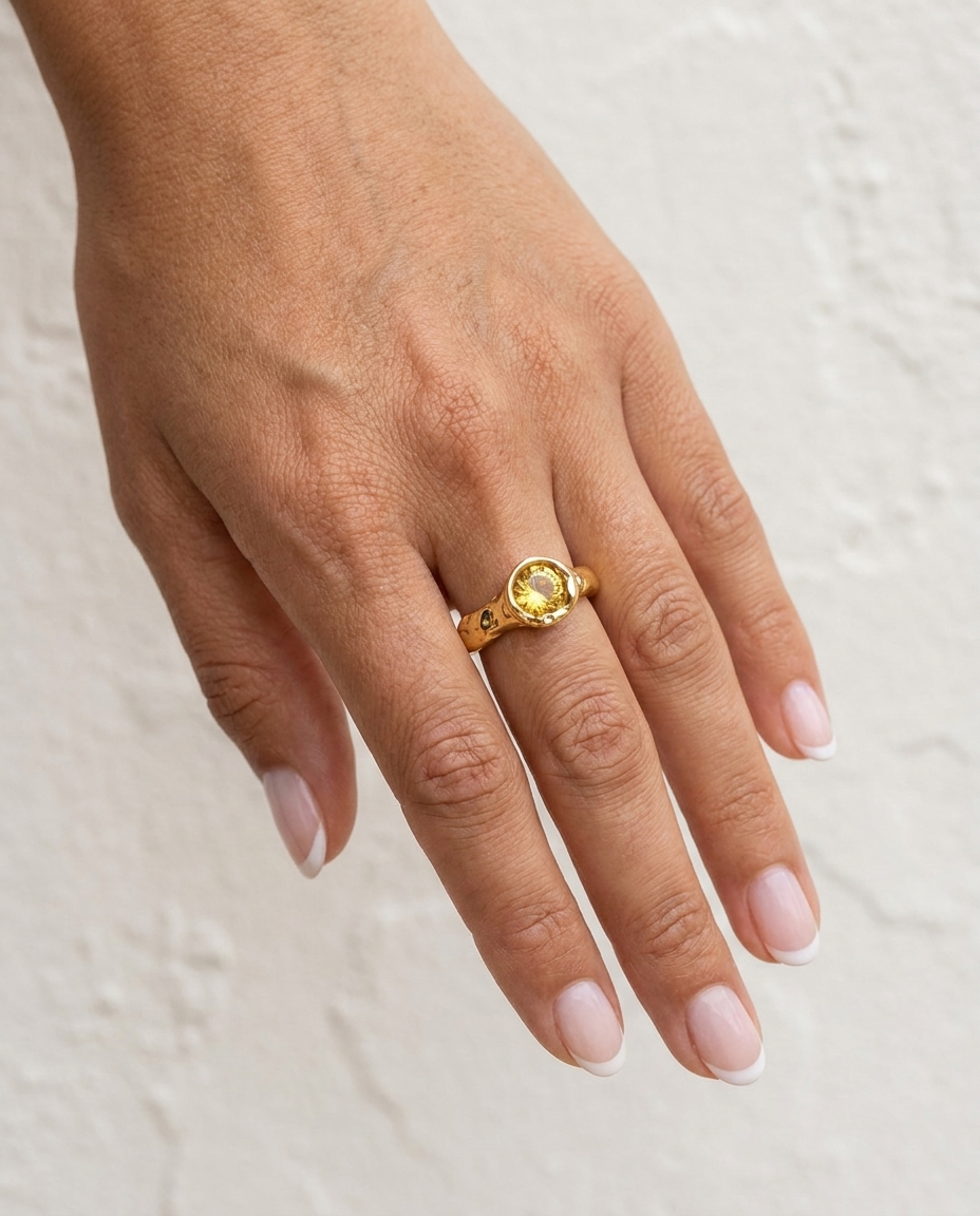 Soleia Citrine Ring on hand against cream wall