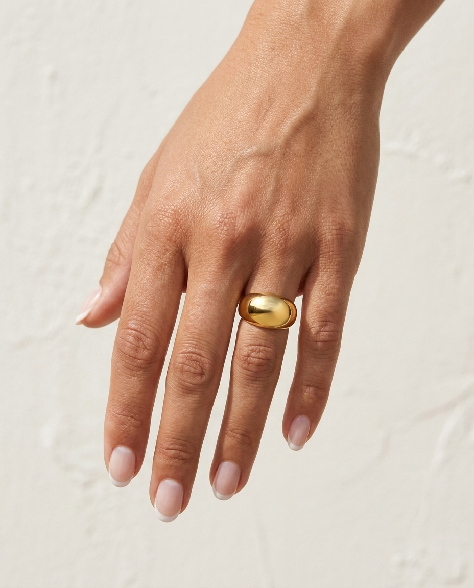 Elle Ring on hand against cream wall