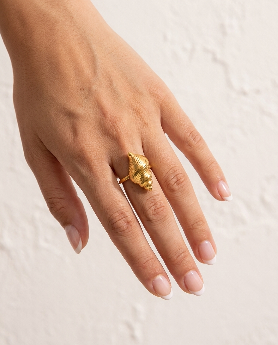 Marisol Golden Seashell Ring cream wall hand