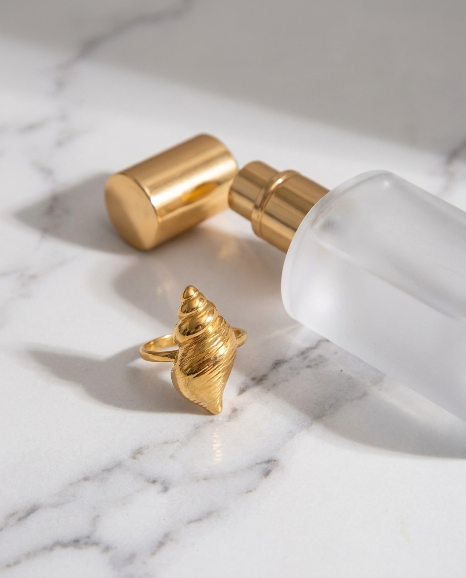 Marisol Golden Seashell Ring marble flatlay