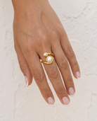 Double Pearl Twist Ring cream wall hand