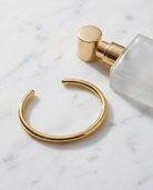 Solene Gold Bangle marble flatlay