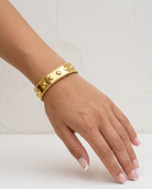 Luna Textured Cuff on wrist plaster wall