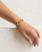Anais Link Bracelet on wrist plaster wall