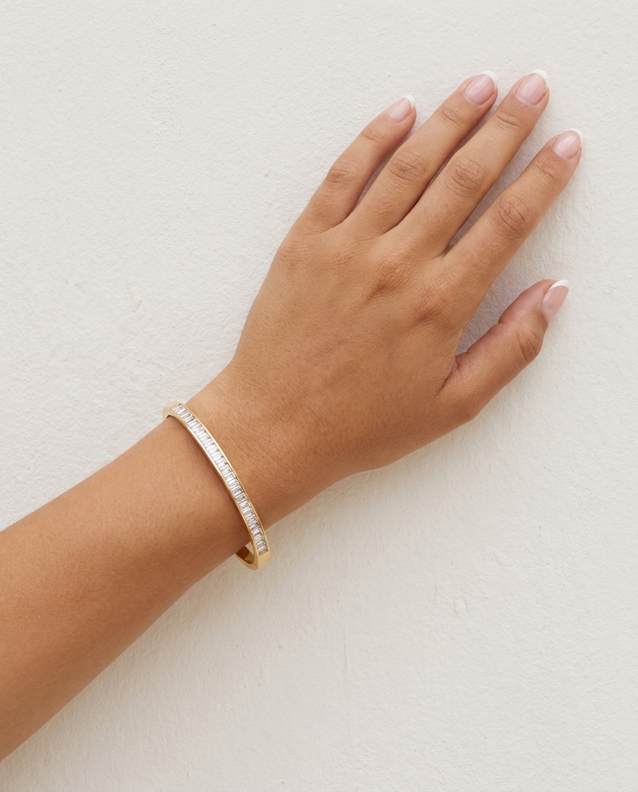 Celine Baguette Bangle on wrist plaster wall