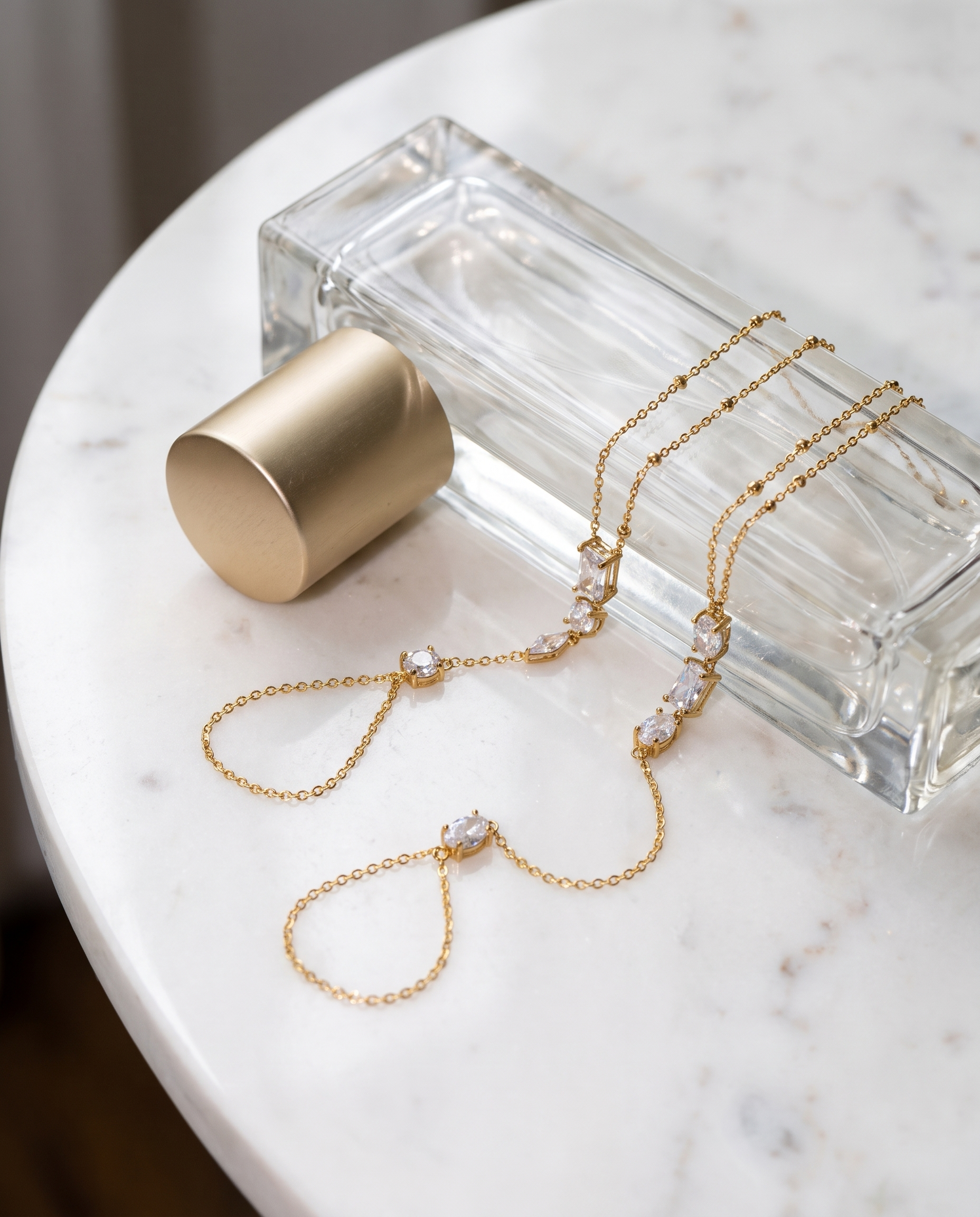 Nadia Hand Chain flatlay on white marble