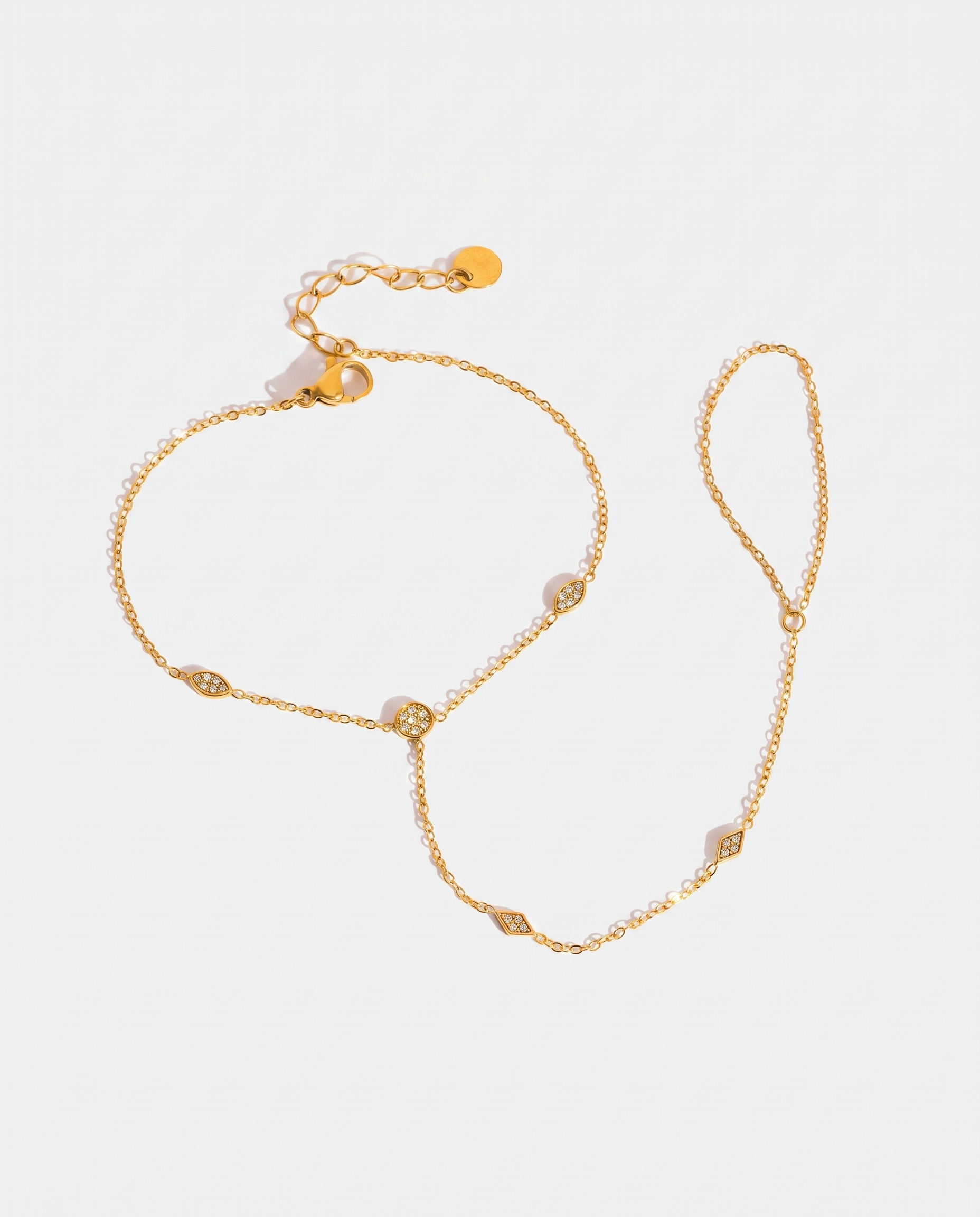 Pia Hand Chain gold hand chain on light grey background