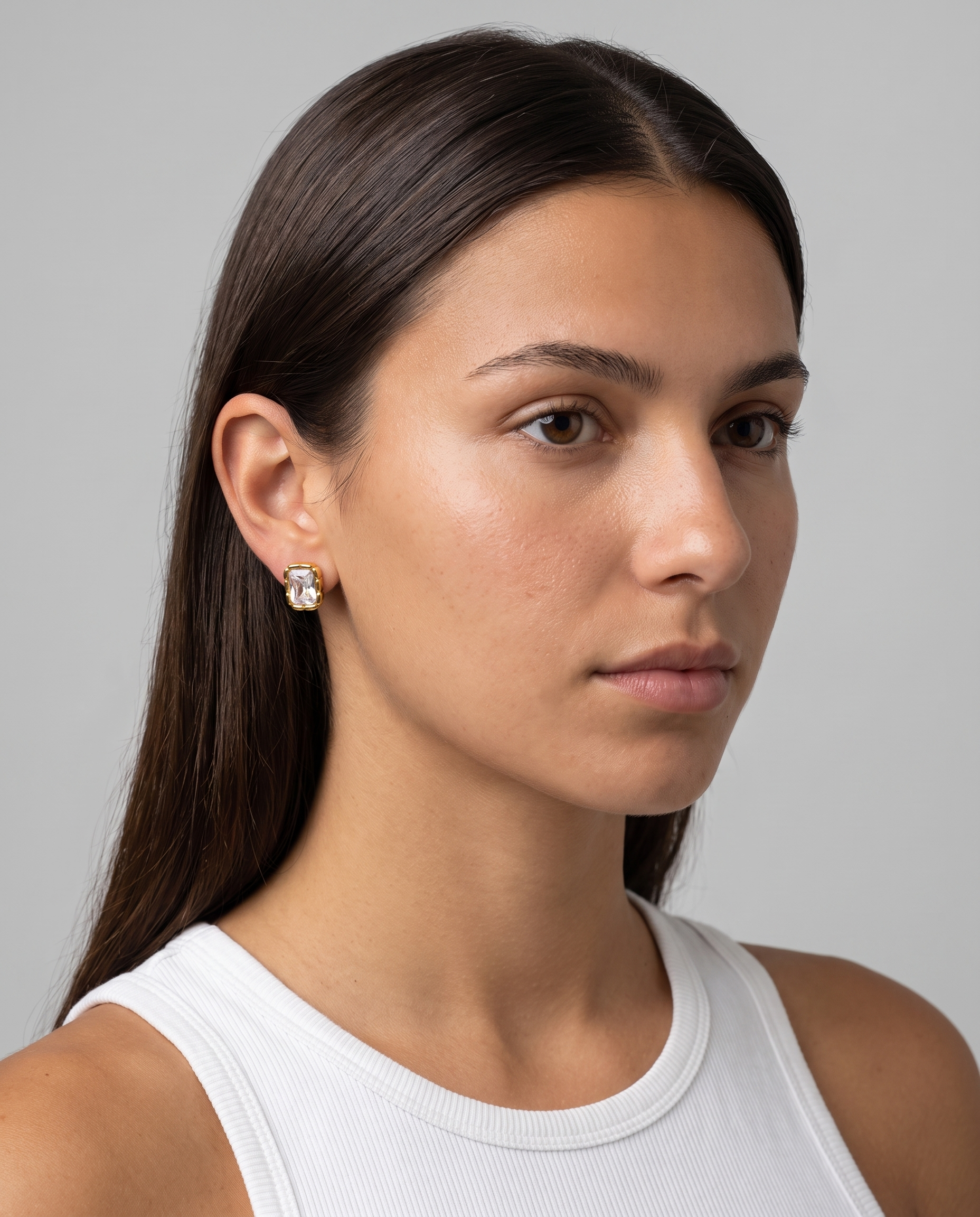 Adèle rectangle stud earring worn on ear