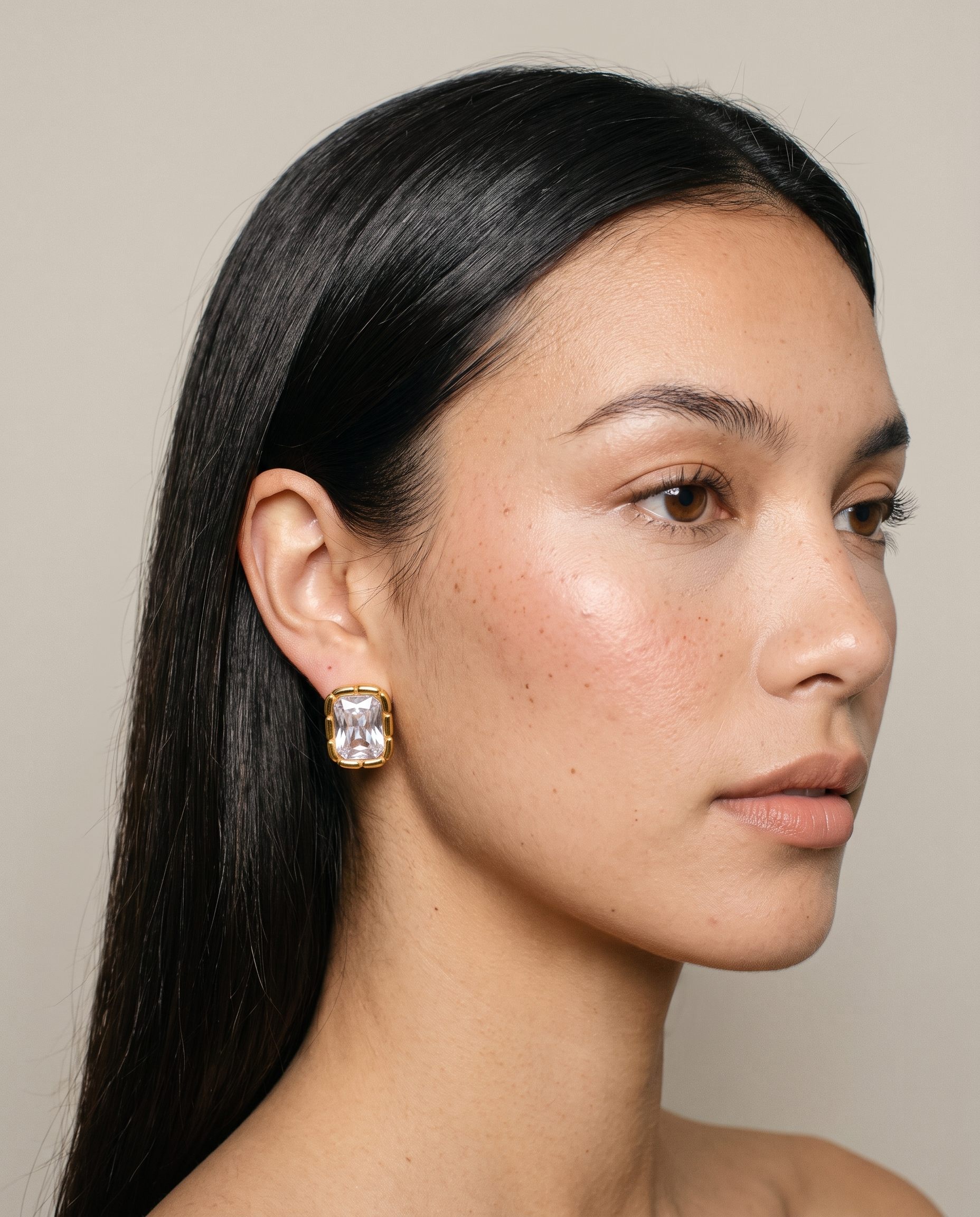 Adèle rectangle stud earring worn on ear