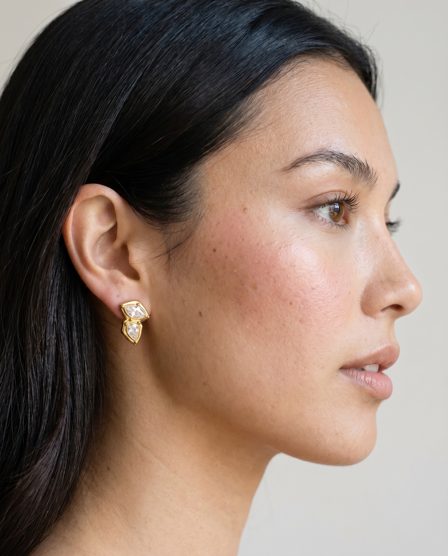 Fern earrings worn on ear