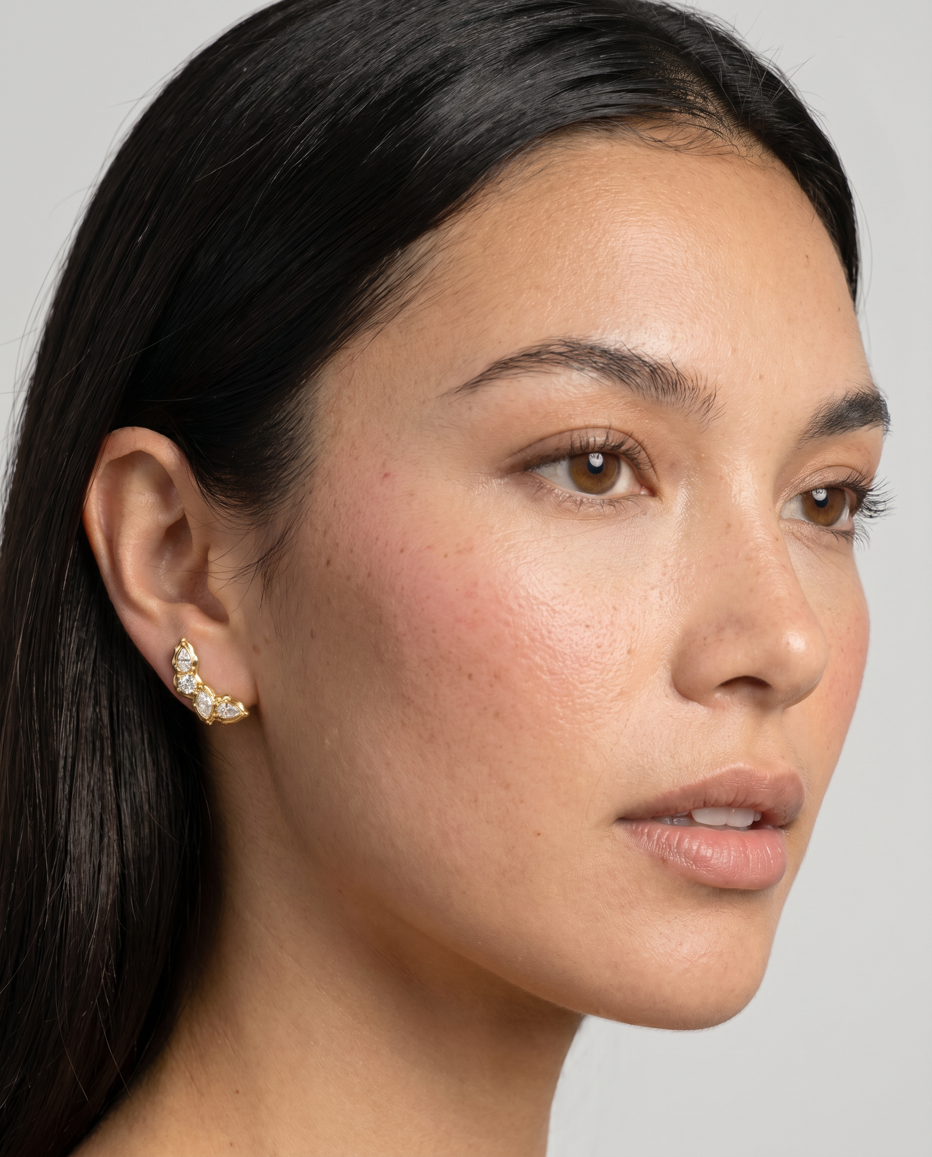 Laurel earrings worn on ear