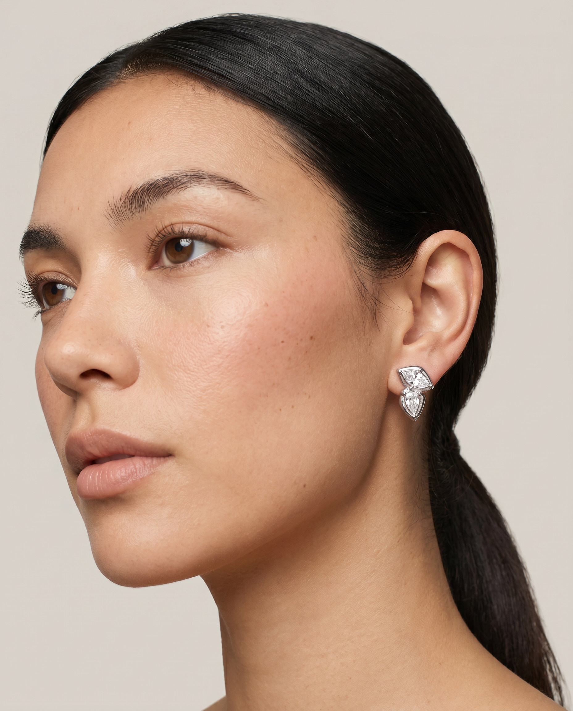 Fern silver earrings worn on ear