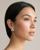 Willow silver earrings worn on ear