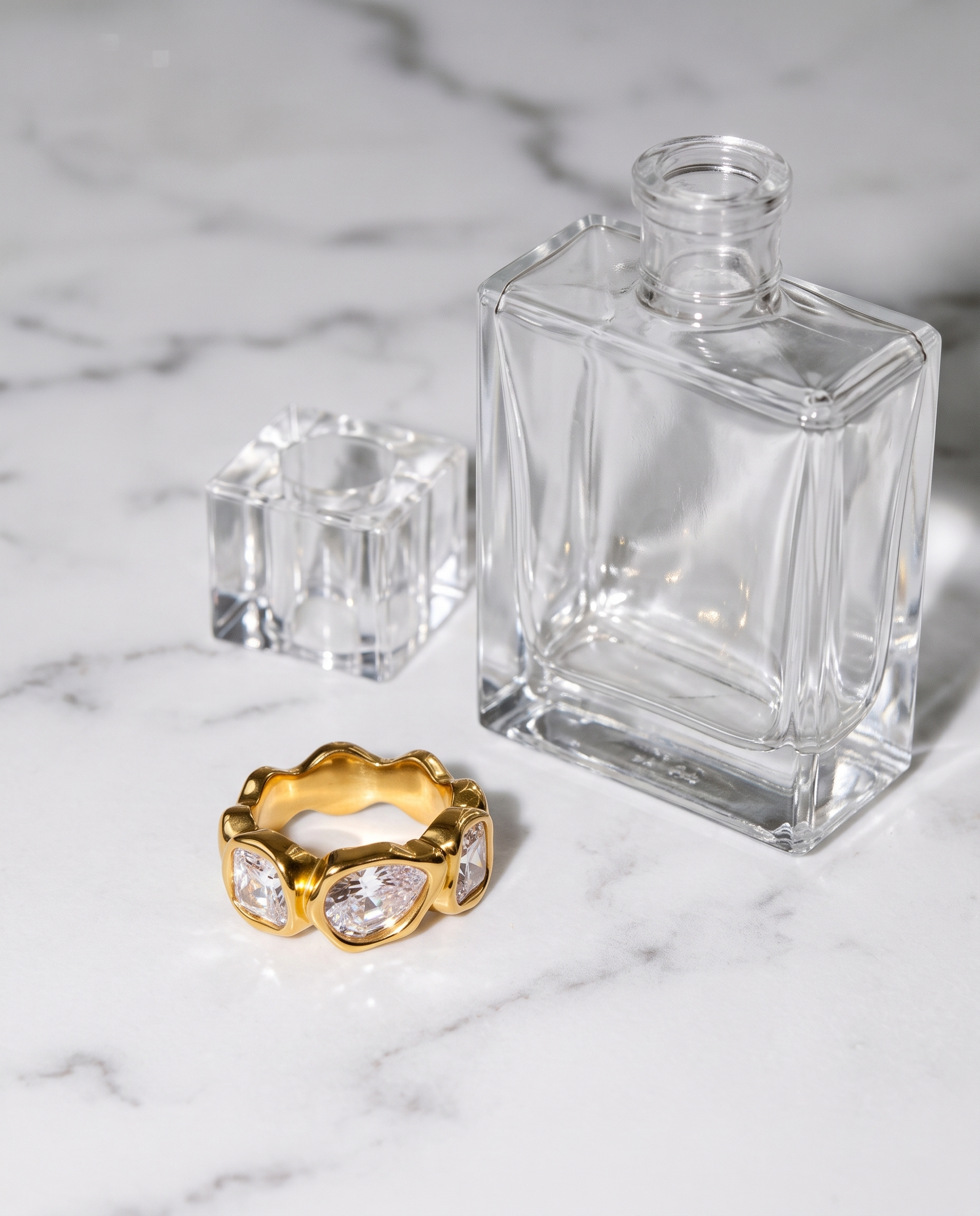 Lison zircon band ring flatlay on marble
