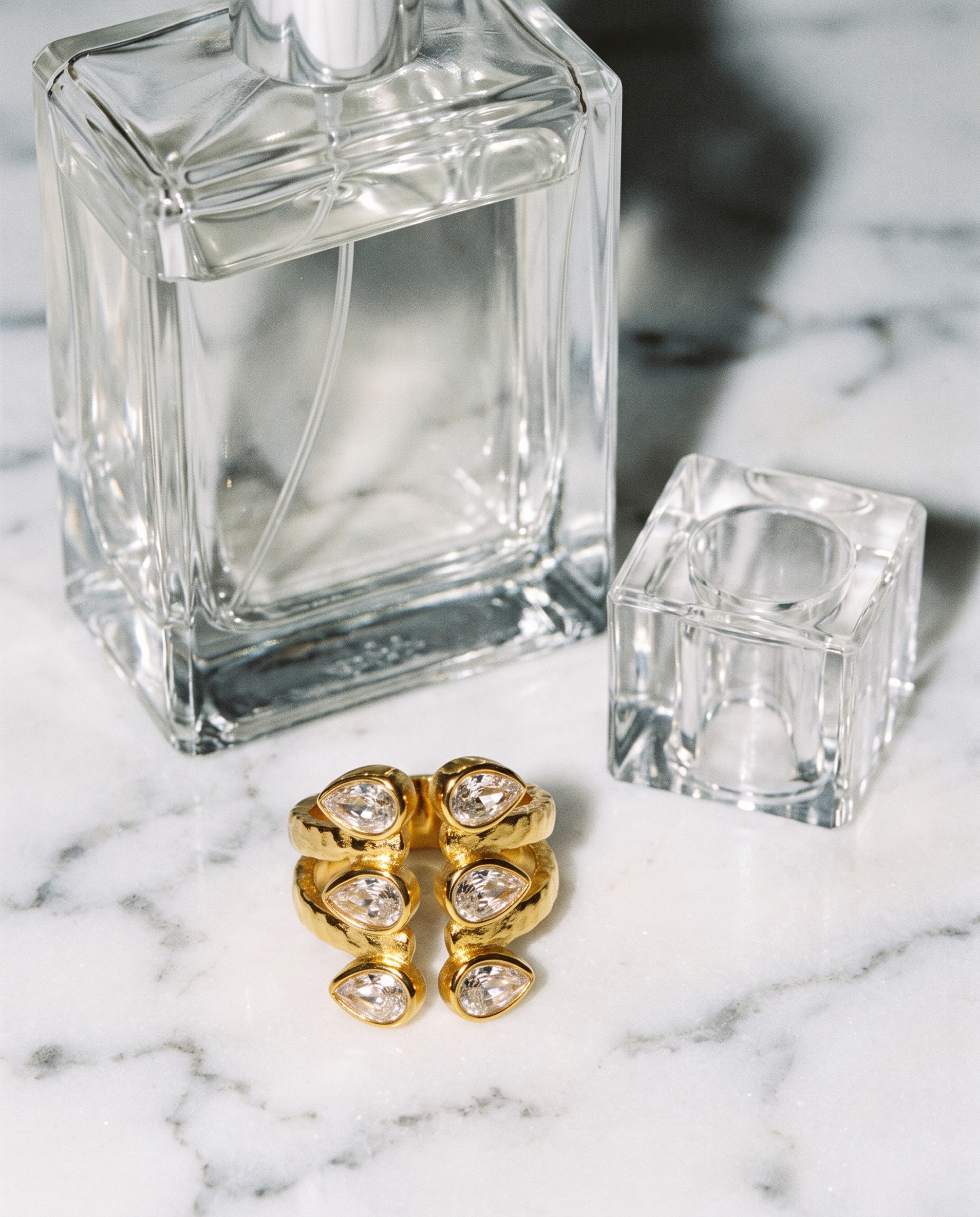 Adele zircon open ring flatlay on marble