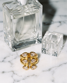 Adele zircon open ring flatlay on marble