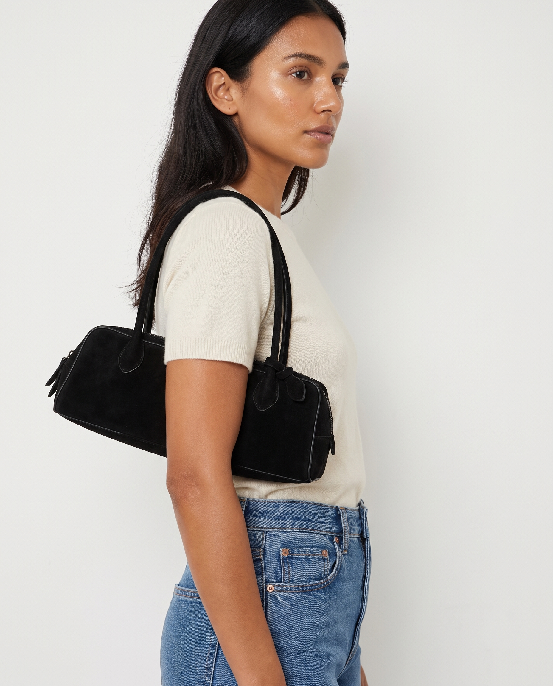 Salome black suede baguette bag worn under the arm