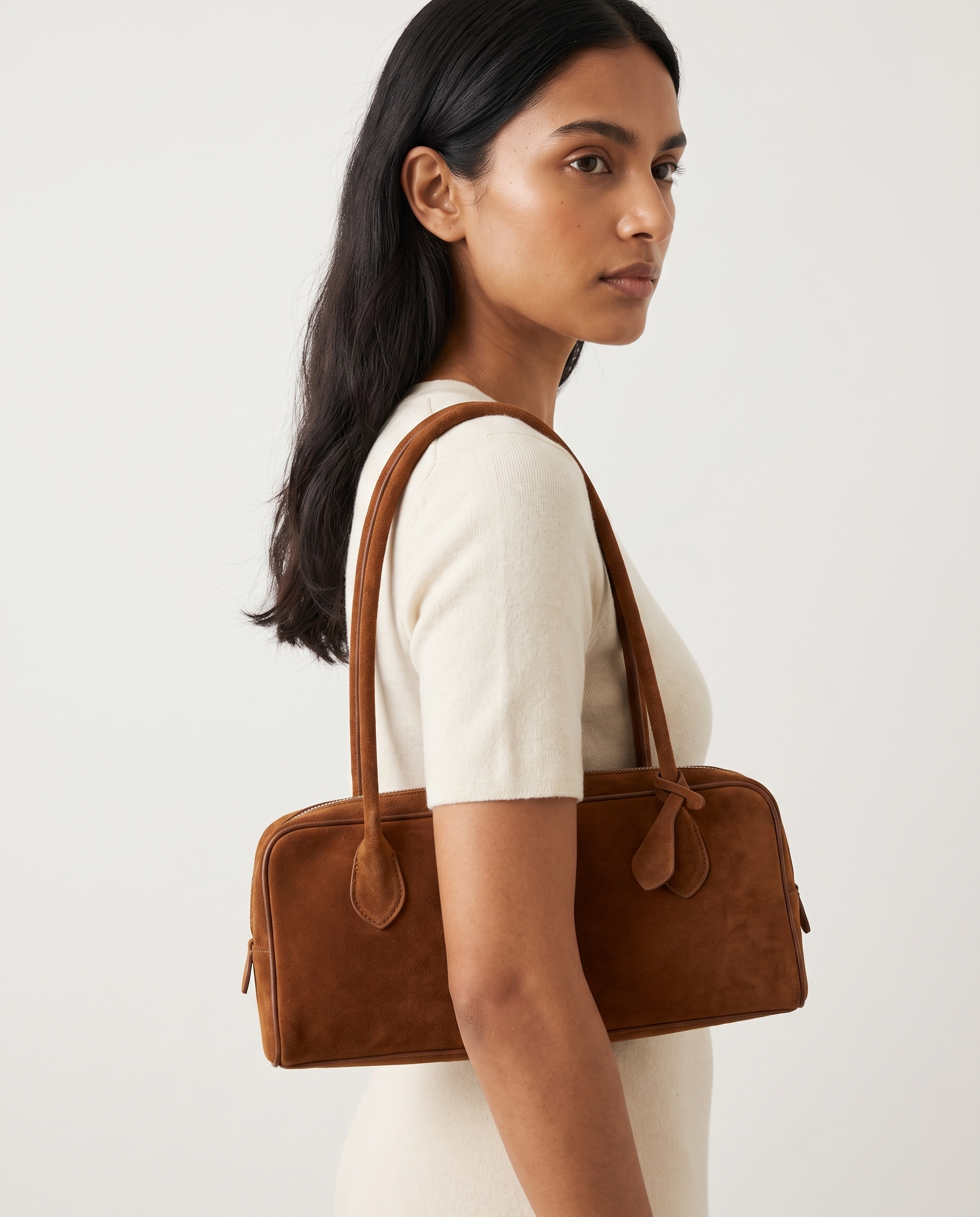 Salome cognac suede baguette bag worn under the arm