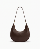 Josephine moon shaped shoulder bag in coffee on off white background
