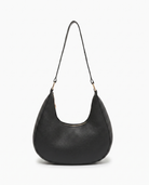 Josephine moon shaped shoulder bag in black on off white background
