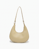 Josephine moon shaped shoulder bag in khaki on off white background