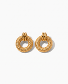 Cleo hammered gold disc earrings pair on off white background