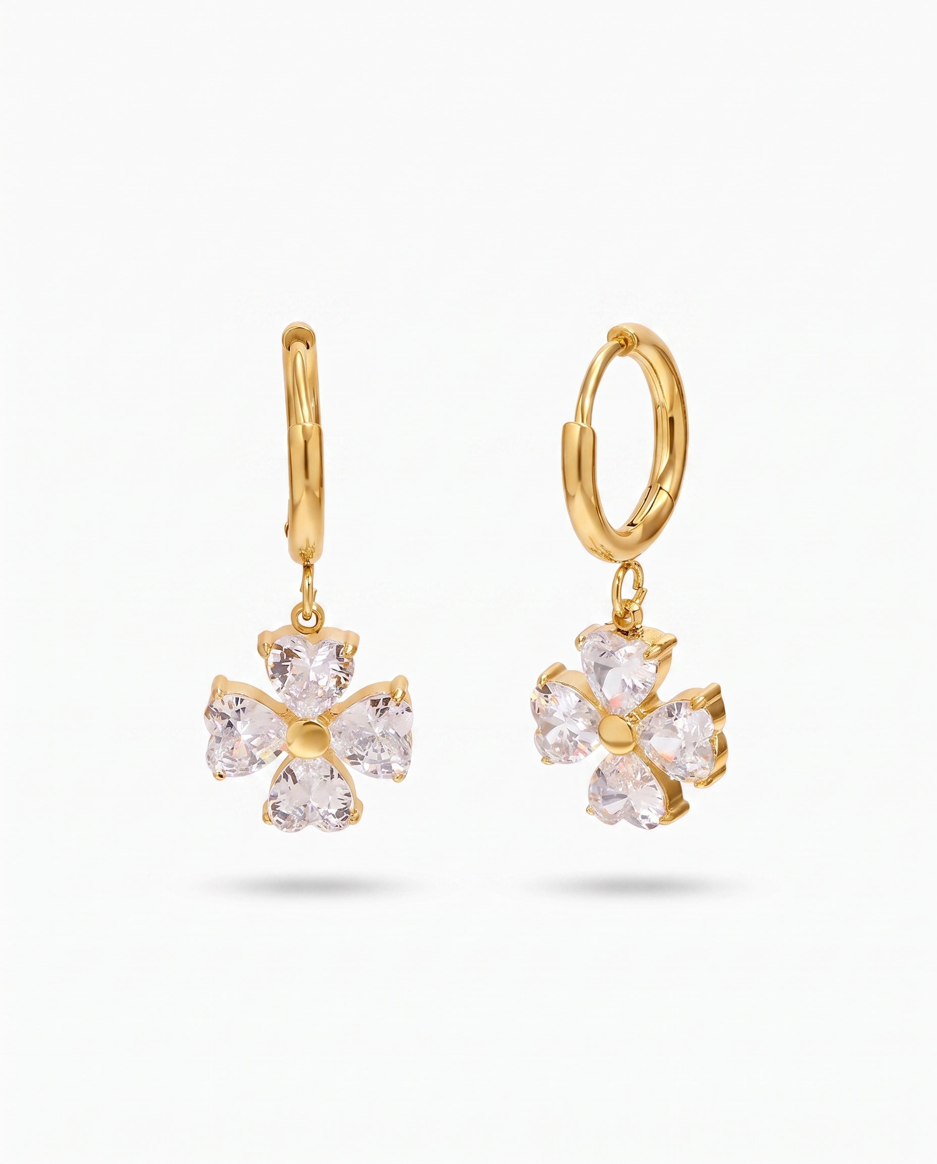 Trefle four leaf clover heart zircon gold hoop earrings pair on off white background