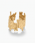 Ecorce bark textured open ring in gold on off white background