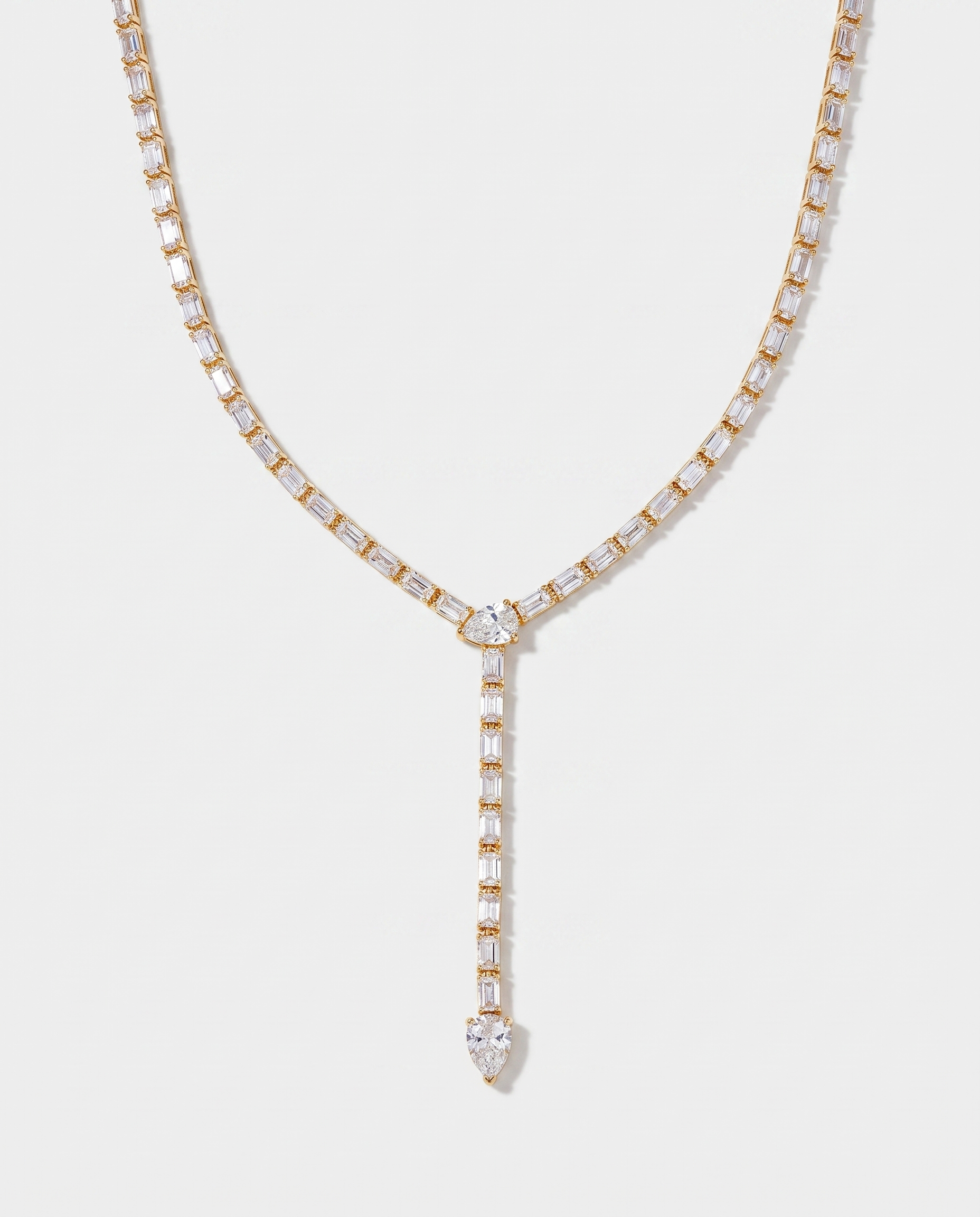 Celeste Y-shaped lariat zircon tennis necklace in gold on off white background