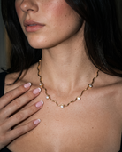 Riviere wavy gold zircon necklace editorial evening flash