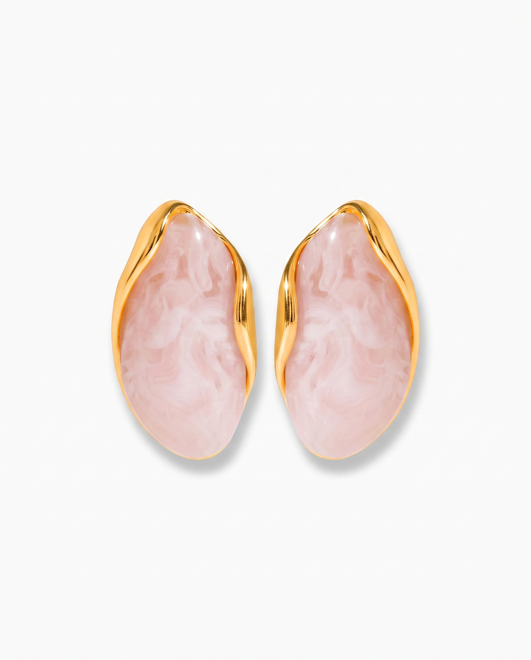 Galet blush pebble studs pair on off white background