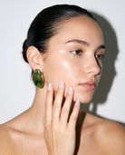 Galet jade pebble studs editorial flash