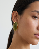 Galet jade pebble studs worn on model