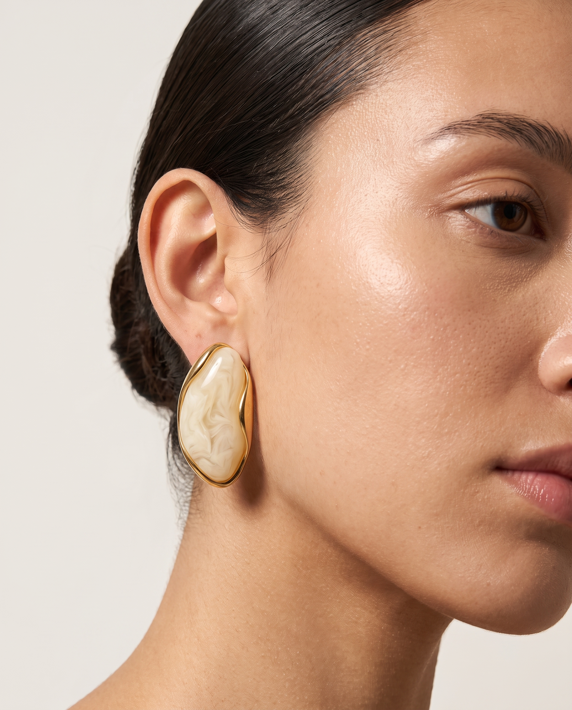 Galet cream pebble studs worn on model