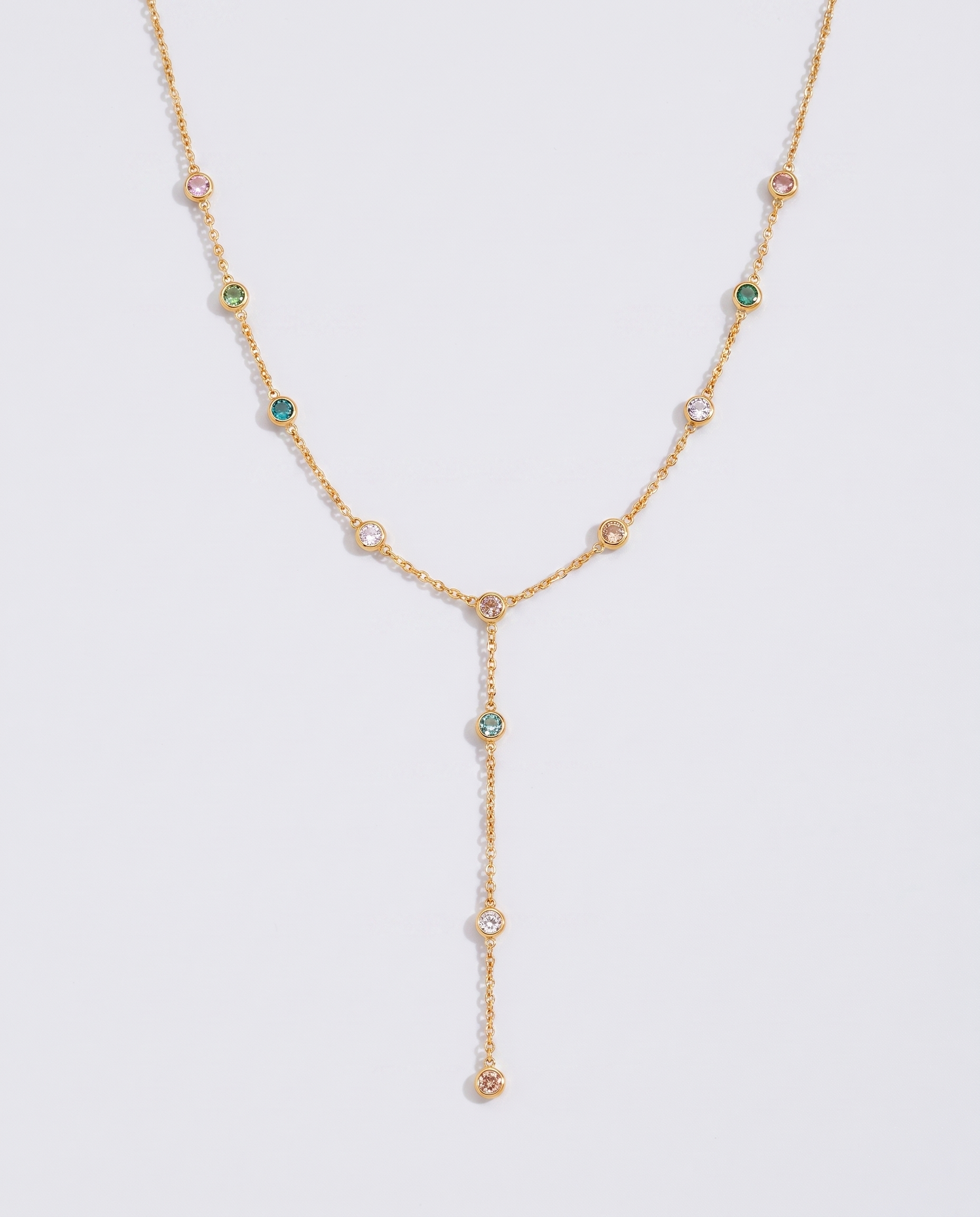Prisme multicoloured zircon Y-lariat gold necklace on off white background