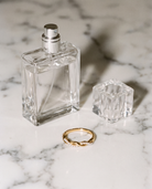 Torsade twisted pearl ring flatlay on marble