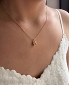 Caillou rose stone necklace worn on model, lifestyle