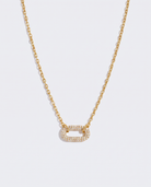 Anneau geometric double ring zircon pendant gold necklace on off white background
