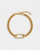 Pave gold curb chain bracelet with zircon link on off white background