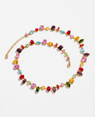 Arlequin multicoloured crystal zircon gold necklace on soft studio background