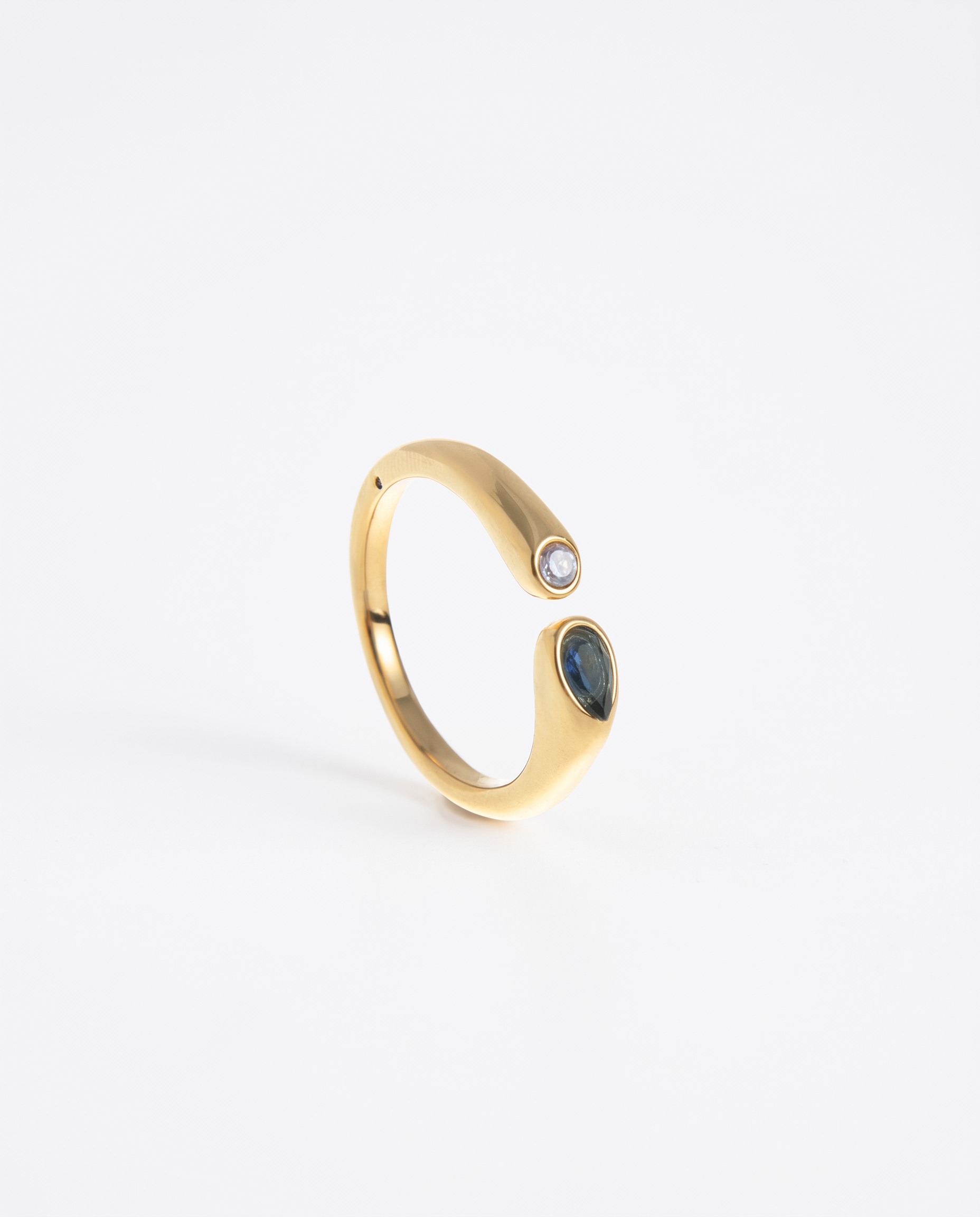 Birthstone ring September blue sapphire gold on soft studio background