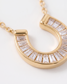 Lucky horseshoe necklace macro detail of baguette cubic zirconia