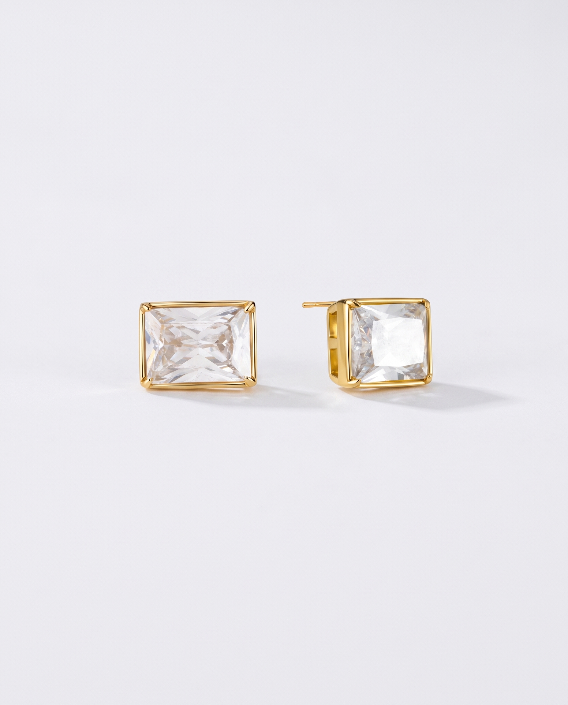 Amelie heart zircon gold stud earrings on off white background
