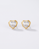 Juliette heart zircon gold stud earrings on off white background