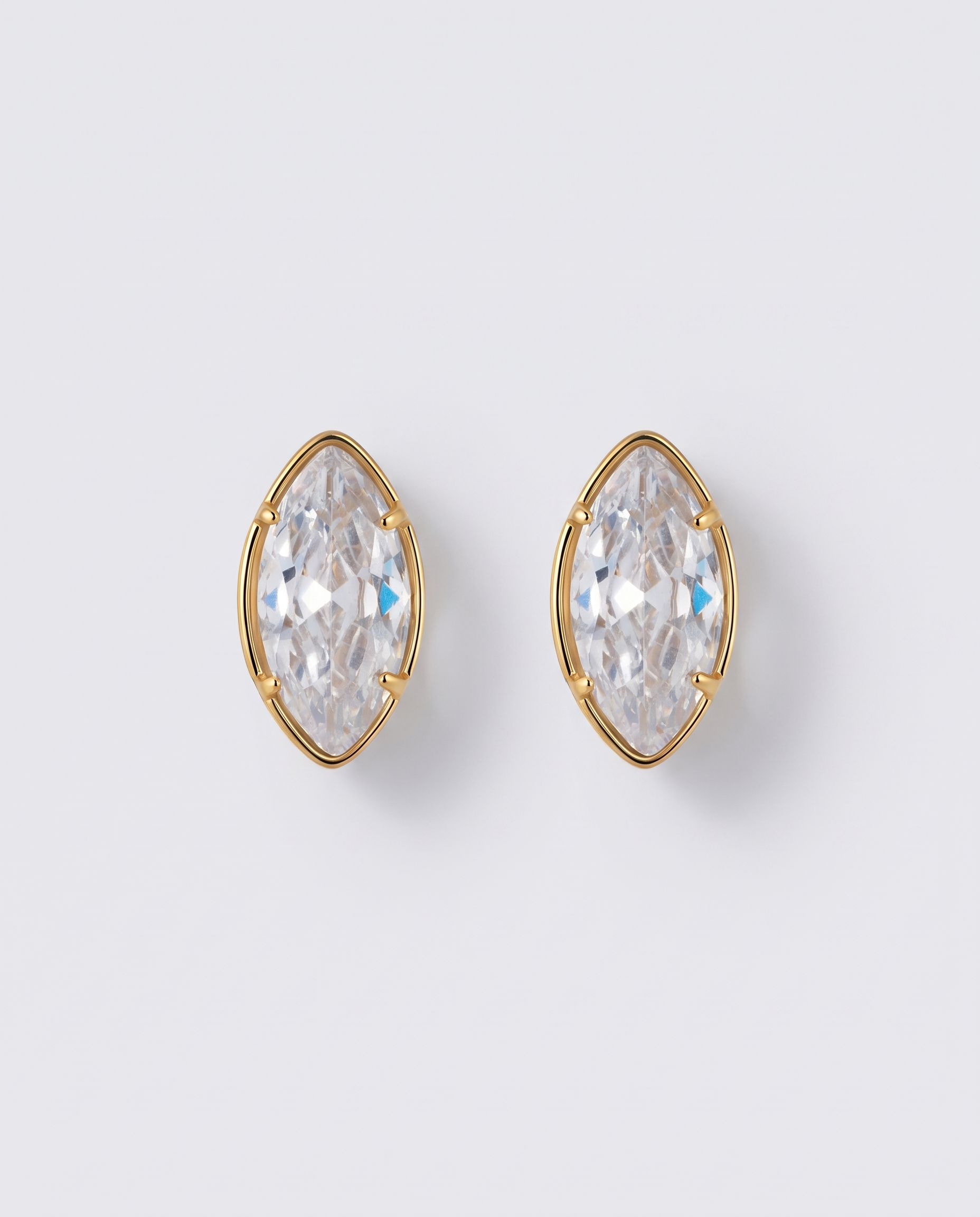 Margaux heart zircon gold stud earrings on off white background