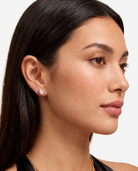 Juliette heart stud earring worn on olive skinned model