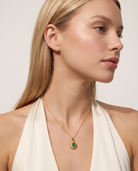 May emerald necklace worn on model