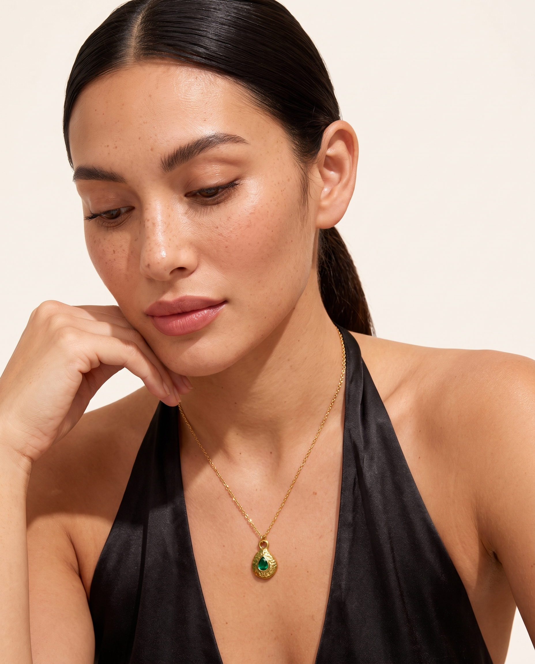 May emerald necklace worn on model second