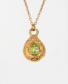 August peridot necklace macro