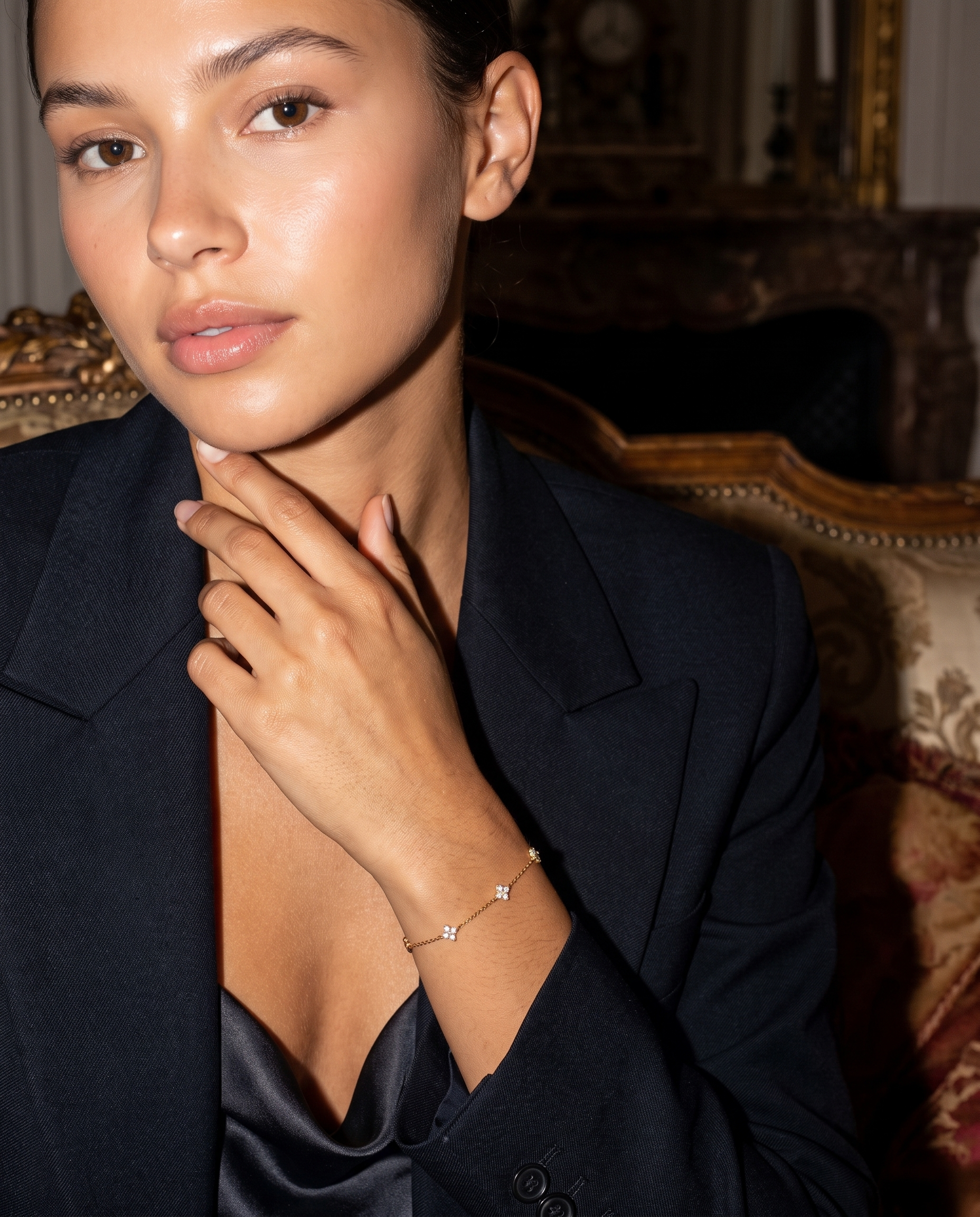 Trefle clover bracelet on model hand to neck